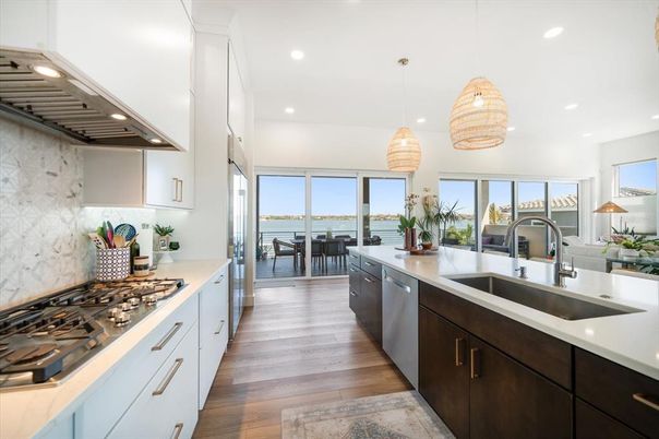 Dining room, Interior, Kitchen, Pendant Lights, Recessed Lighting, Stainless Steel Appliances, Water, Wood Texture Flooring