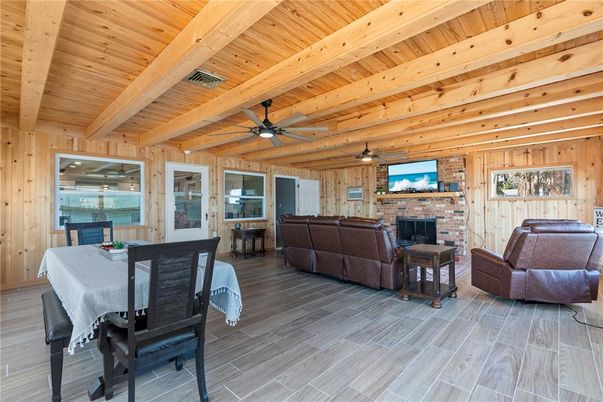 Dining room, Fireplace, Interior, Living room, Stone Walls, Water, Wooden Beams, Wooden Ceilings, Wood Texture Flooring, Wooden Walls