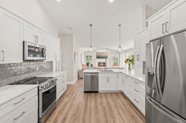 Interior, Kitchen, Pendant Lights, Recessed Lighting, Stainless Steel Appliances, Wood Texture Flooring