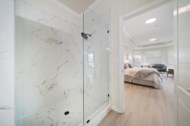 Bathroom, Bedroom, Glass Shower, Interior, Marble Walls, Recessed Lighting, Wood Texture Flooring