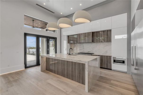 Interior, Kitchen, Marble Walls, Pendant Lights, Recessed Lighting, Stainless Steel Appliances, Wood Texture Flooring