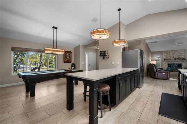 Billiard Table, Fireplace, Game Room, Interior, Pendant Lights, Stone Walls, Wood Texture Flooring