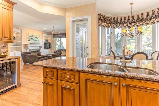 Chandelier, Dining room, Fireplace, Interior, Kitchen, Living room, Recessed Lighting, Wood Texture Flooring