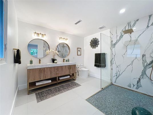 Bathroom, Dual Sink Vanities, Glass Shower, Interior, Marble Walls, Recessed Lighting