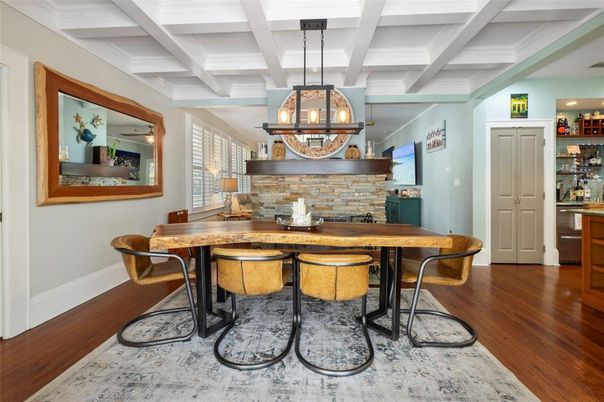 Chandelier, Dining room, Fireplace, Interior, Stone Walls, Wood Texture Flooring