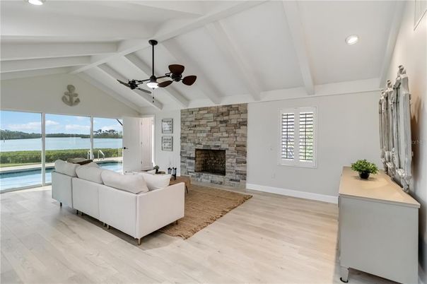 Fireplace, Interior, Living room, Recessed Lighting, Stone Walls, Water, Wood Texture Flooring