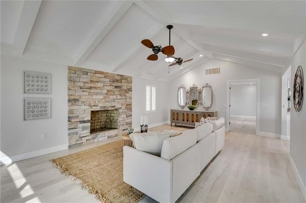 Fireplace, Interior, Living room, Recessed Lighting, Stone Walls, Wood Texture Flooring