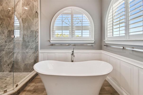 Bathroom, Free Standing Baths, Glass Shower, Interior, Marble Walls, Wood Texture Flooring