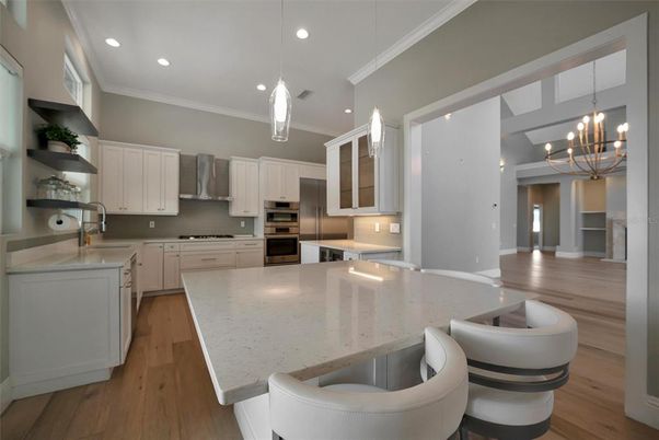 Chandelier, Interior, Kitchen, Pendant Lights, Recessed Lighting, Stainless Steel Appliances, Wood Texture Flooring