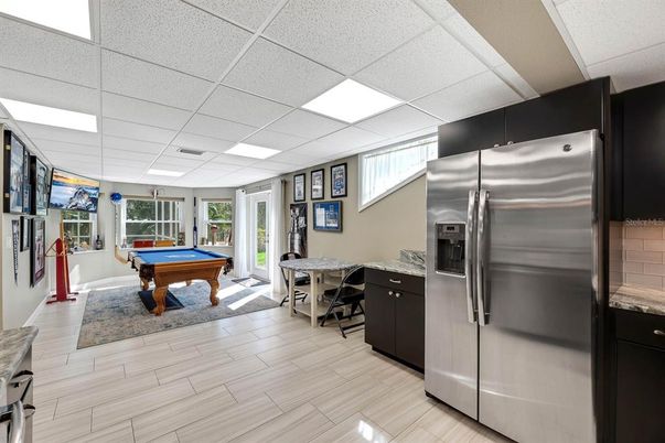 Billiard Table, Dining room, Game Room, Interior, Kitchen, Stainless Steel Appliances, Wood Texture Flooring