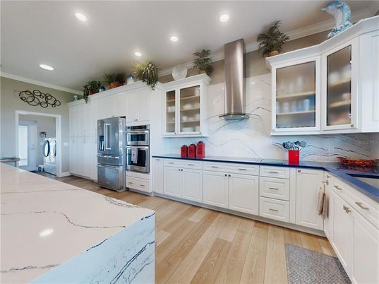 Interior, Kitchen, Marble Walls, Recessed Lighting, Stainless Steel Appliances, Wood Texture Flooring