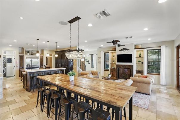 Chandelier, Fireplace, Interior, Kitchen, Living room, Pendant Lights, Recessed Lighting, Stainless Steel Appliances