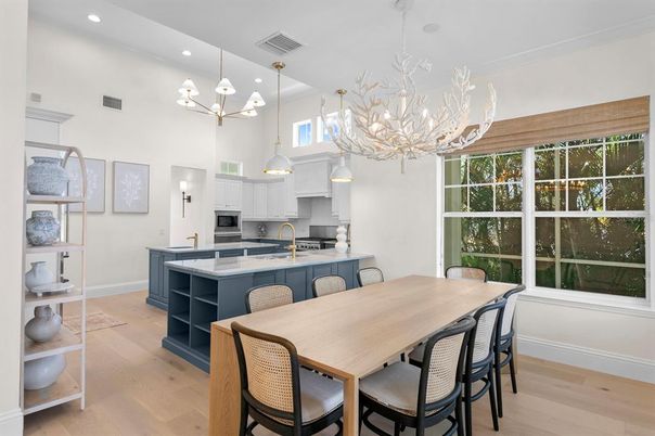 Chandelier, Dining room, Interior, Kitchen, Pendant Lights, Recessed Lighting, Stainless Steel Appliances, Wood Texture Flooring