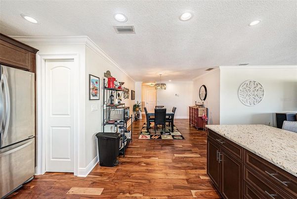 Chandelier, Dining room, Interior, Kitchen, Recessed Lighting, Stainless Steel Appliances, Wood Texture Flooring