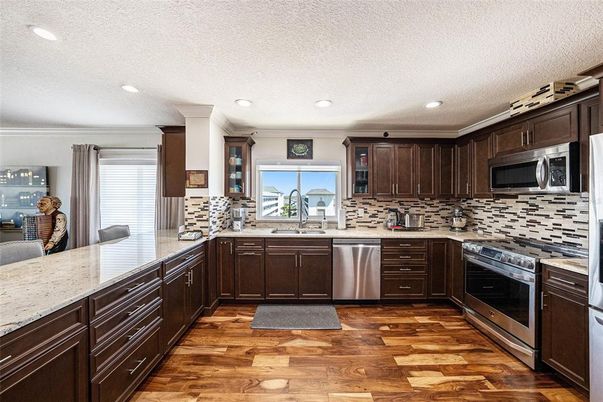 Interior, Kitchen, Recessed Lighting, Stainless Steel Appliances, Wood Texture Flooring