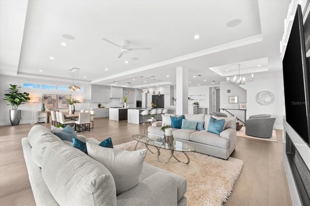 Chandelier, Dining room, Interior, Kitchen, Living room, Pendant Lights, Recessed Lighting, Stainless Steel Appliances, Wood Texture Flooring