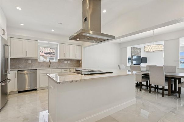 Chandelier, Dining room, Interior, Kitchen, Pendant Lights, Recessed Lighting, Stainless Steel Appliances, Tile Countertops