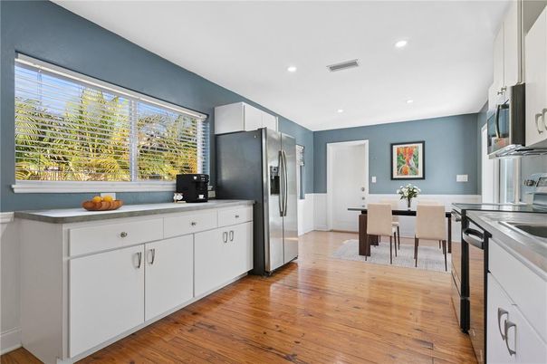 Dining room, Interior, Kitchen, Recessed Lighting, Stainless Steel Appliances, Wood Texture Flooring