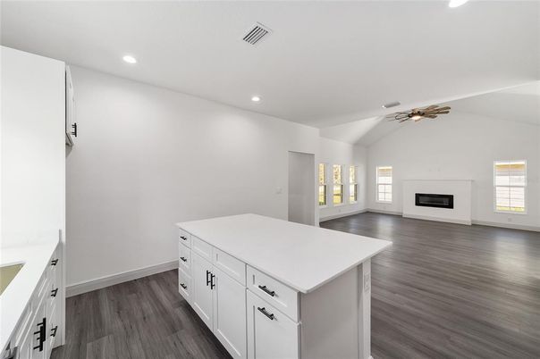 Empty room, Fireplace, Interior, Kitchen, Recessed Lighting, Wood Texture Flooring