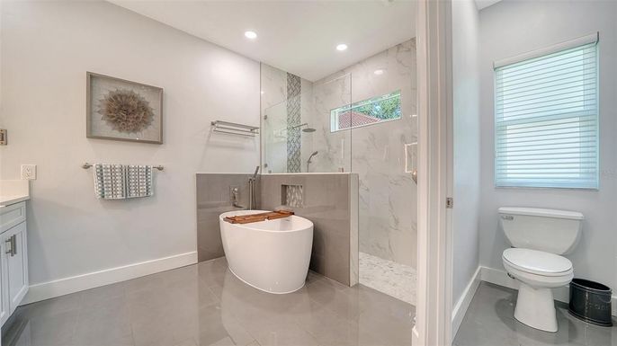 Bathroom, Free Standing Baths, Glass Shower, Interior, Marble Walls, Recessed Lighting
