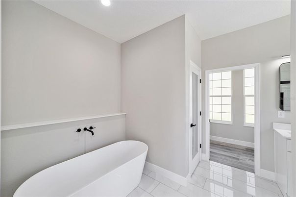 Bathroom, Free Standing Baths, Interior, Marble, Recessed Lighting, Wood Texture Flooring
