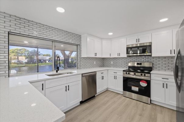 Interior, Kitchen, Recessed Lighting, Stainless Steel Appliances, Wood Texture Flooring
