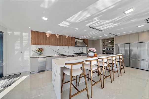 Interior, Kitchen, Marble Walls, Recessed Lighting, Stainless Steel Appliances