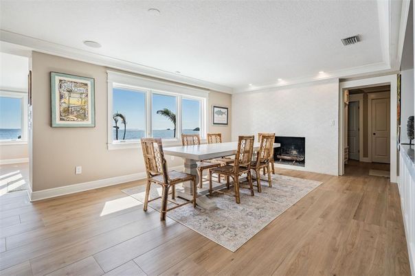 Dining room, Fireplace, Interior, Recessed Lighting, Water, Wood Texture Flooring