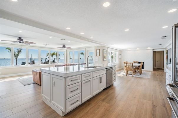 Dining room, Interior, Kitchen, Recessed Lighting, Stainless Steel Appliances, Water, Wood Texture Flooring