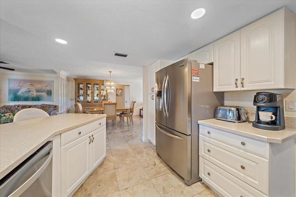 Chandelier, Dining room, Interior, Kitchen, Pendant Lights, Recessed Lighting, Stainless Steel Appliances