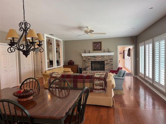 Chandelier, Dining room, Fireplace, Interior, Living room, Recessed Lighting, Wood Texture Flooring