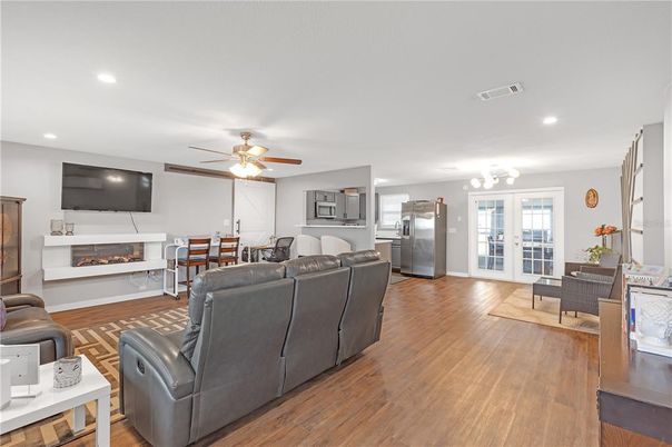 Dining room, Fireplace, Interior, Kitchen, Living room, Recessed Lighting, Wood Texture Flooring