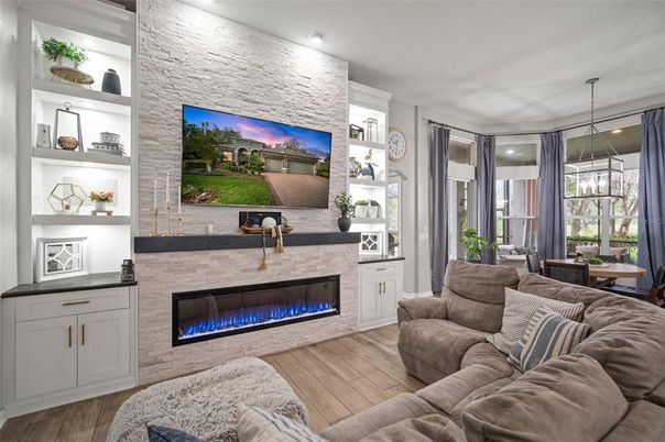 Fireplace, Interior, Living room, Pendant Lights, Recessed Lighting, Stone Walls, Wood Texture Flooring