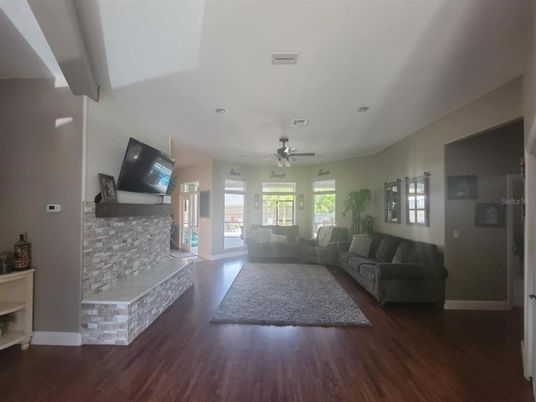 Fireplace, Interior, Living room, Recessed Lighting, Wood Texture Flooring