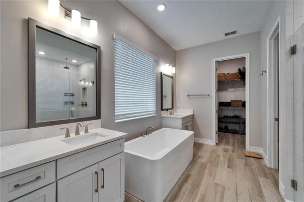 Bathroom, Dual Sink Vanities, Free Standing Baths, Interior, Recessed Lighting, Walk-in Closets, Wood Texture Flooring