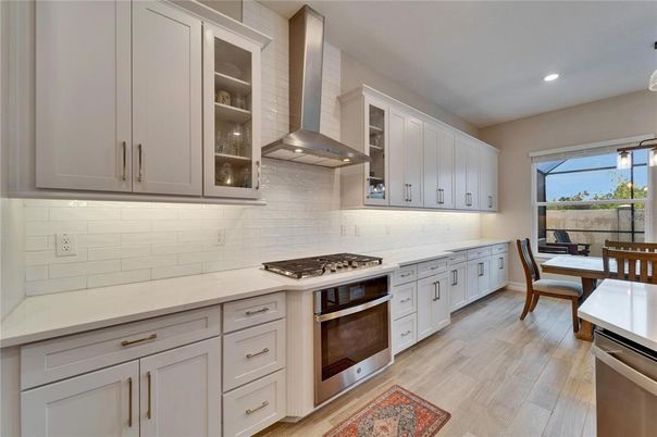 Dining room, Interior, Kitchen, Recessed Lighting, Stainless Steel Appliances, Wood Texture Flooring