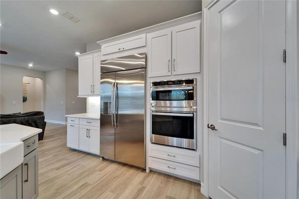 Interior, Kitchen, Recessed Lighting, Stainless Steel Appliances, Wood Texture Flooring