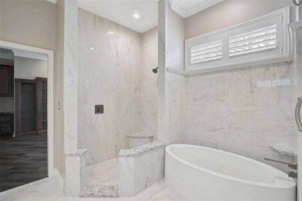 Bathroom, Free Standing Baths, Interior, Marble, Marble Walls, Recessed Lighting, Wood Texture Flooring