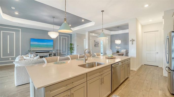 Chandelier, Dining room, Interior, Kitchen, Living room, Pendant Lights, Recessed Lighting, Stainless Steel Appliances, Wood Texture Flooring