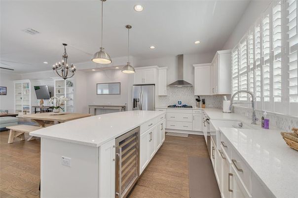 Chandelier, Dining room, Interior, Kitchen, Pendant Lights, Recessed Lighting, Stainless Steel Appliances, Wood Texture Flooring
