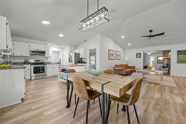 Dining room, Interior, Kitchen, Living room, Pendant Lights, Recessed Lighting, Stainless Steel Appliances, Wood Texture Flooring