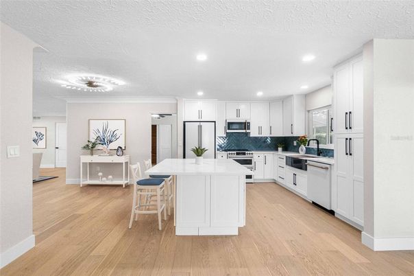 Dining room, Interior, Kitchen, Recessed Lighting, Stainless Steel Appliances, Wood Texture Flooring
