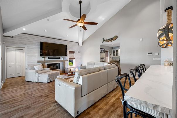 Dining room, Fireplace, Interior, Living room, Recessed Lighting, Wood Texture Flooring