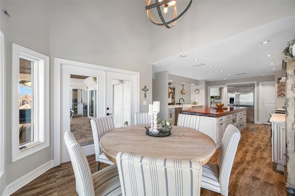 Dining room, Interior, Kitchen, Pendant Lights, Recessed Lighting, Stainless Steel Appliances, Wood Texture Flooring