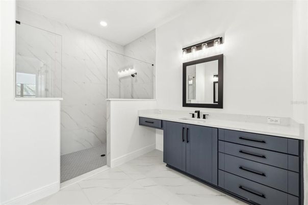 Bathroom, Dual Sink Vanities, Glass Shower, Interior, Marble, Marble Walls, Recessed Lighting
