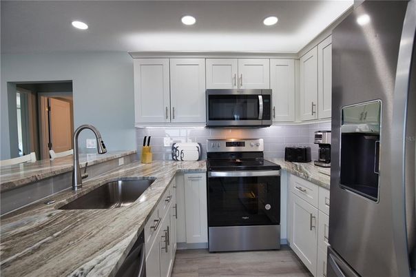 Interior, Kitchen, Recessed Lighting, Stainless Steel Appliances, Wood Texture Flooring