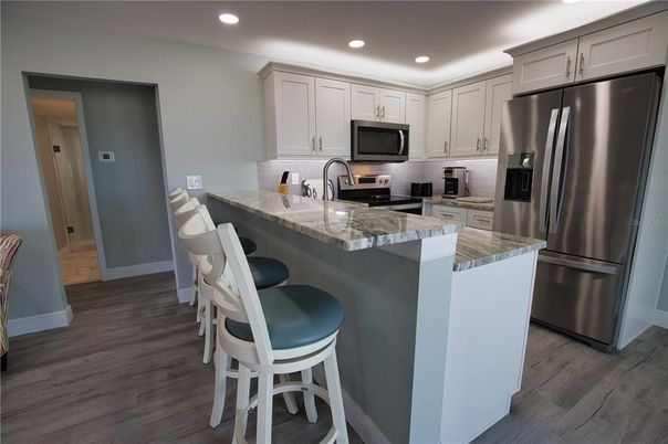 Interior, Kitchen, Recessed Lighting, Stainless Steel Appliances, Wood Texture Flooring
