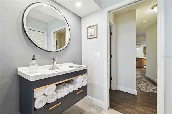 Bathroom, Dual Sink Vanities, Interior, Recessed Lighting, Wood Texture Flooring