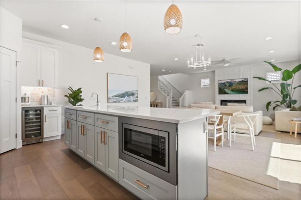 Dining room, Fireplace, Interior, Kitchen, Pendant Lights, Recessed Lighting, Stainless Steel Appliances, Wood Texture Flooring