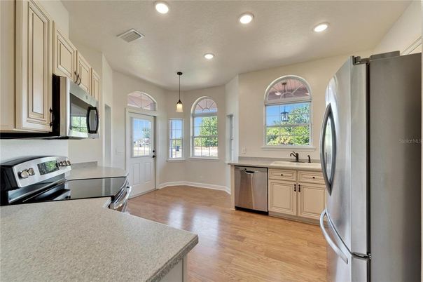 Interior, Kitchen, Pendant Lights, Recessed Lighting, Stainless Steel Appliances, Wood Texture Flooring